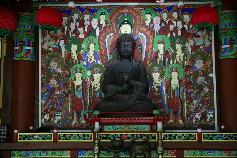 a large buddha statue sitting inside of a building, a statue, by Kim Tschang Yeul, cloisonnism, full frame image