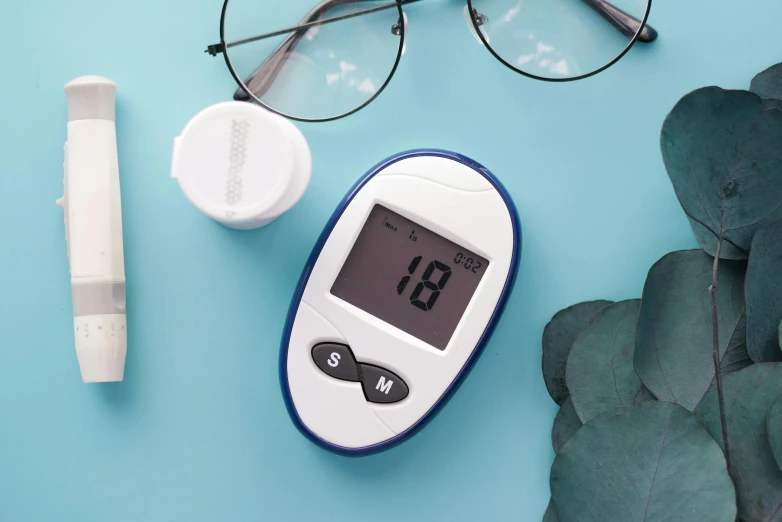 an electronic thermometer next to a pair of glasses and a pen, a picture, by Julia Pishtar, trending on pexels, bauhaus, lake blue, medical labels, 3 2 mm, 4l