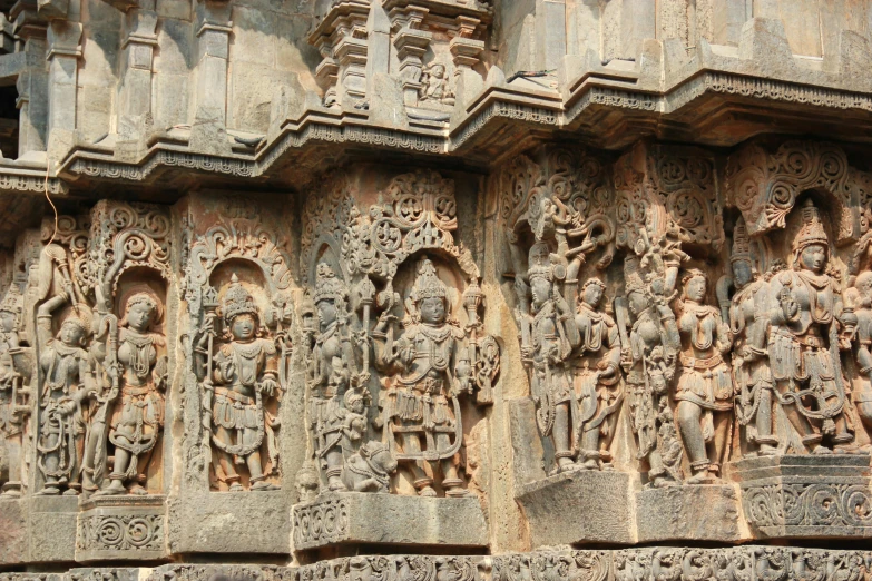 a group of carvings on the side of a building, pexels contest winner, samikshavad, in an ancient altar, thumbnail, listing image, photo for magazine