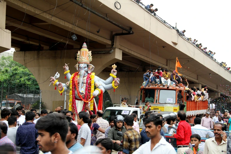 a group of people that are standing in the street, reddit, samikshavad, ganapati, orange line, parade floats, avatar image