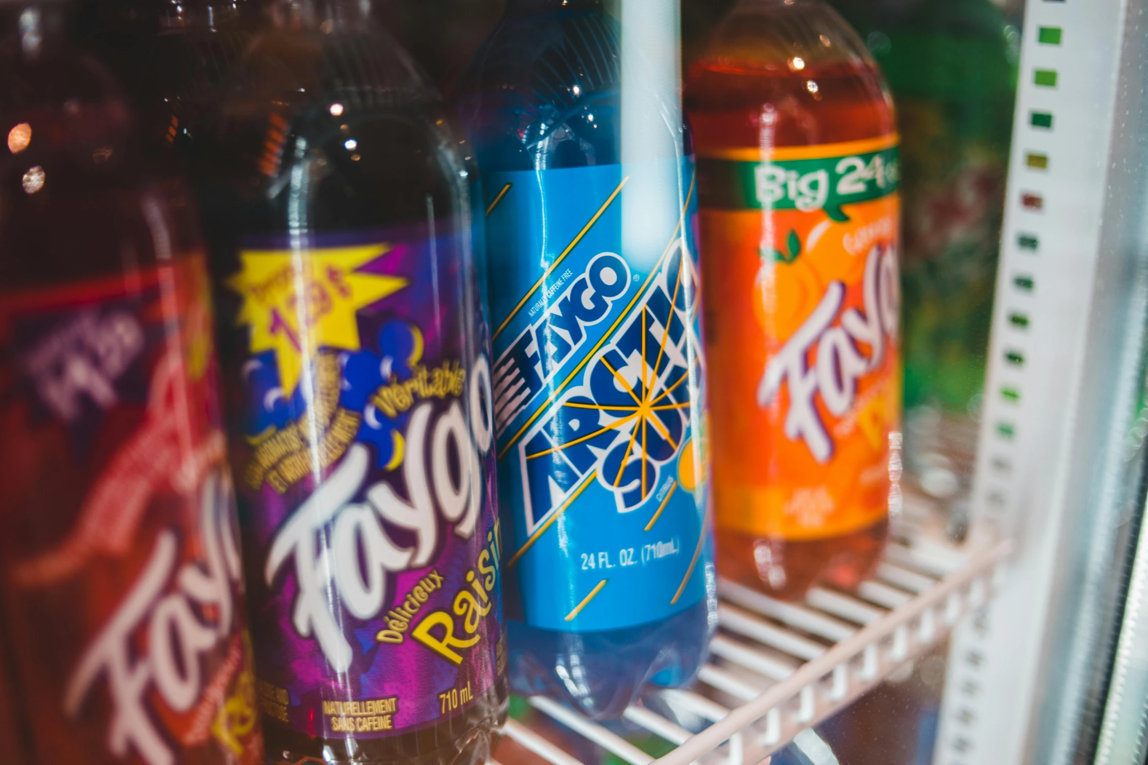 a close up of bottles of soda on a shelf, a portrait, by Matt Cavotta, pexels, toyism, in a taco bell, blue indygo thunder lightning, thumbnail, infused with zerg hydralisk