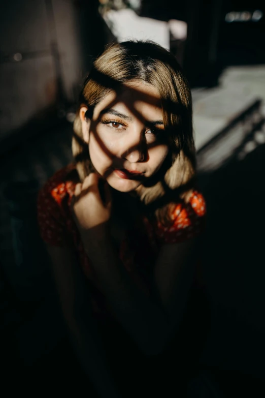 a woman that is standing in the dark, inspired by Elsa Bleda, pexels contest winner, portrait casting long shadows, sydney sweeney, 4 k asymmetrical portrait, overexposed sunlight