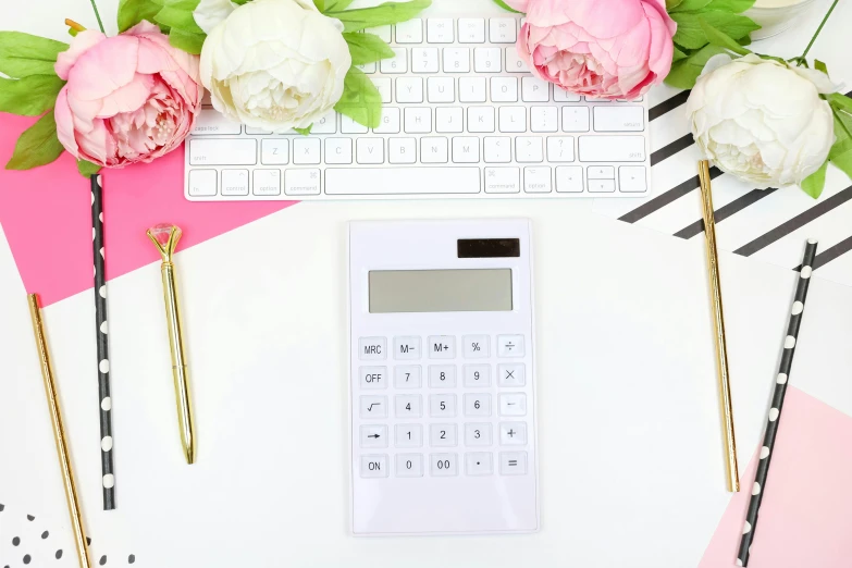 a calculator sitting on top of a desk next to a keyboard, by Julia Pishtar, pexels, pink flowers, white color scheme, instagram post, 15081959 21121991 01012000 4k