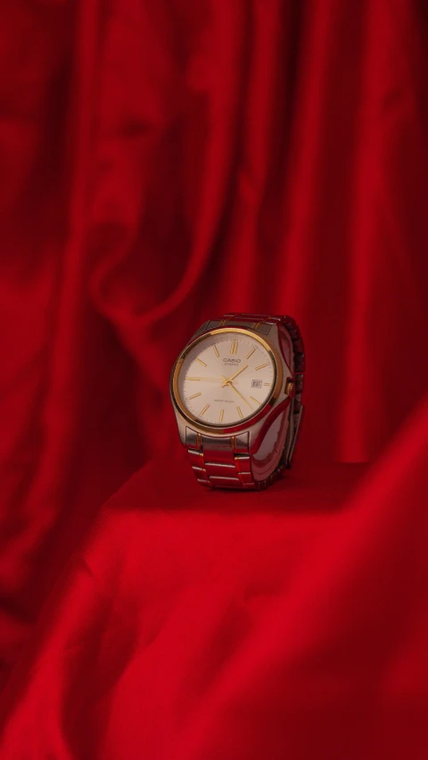 a close up of a watch on a red cloth, by Derek Chittock, pexels contest winner, photorealism, red curtain, kintsugi, thumbnail, demur