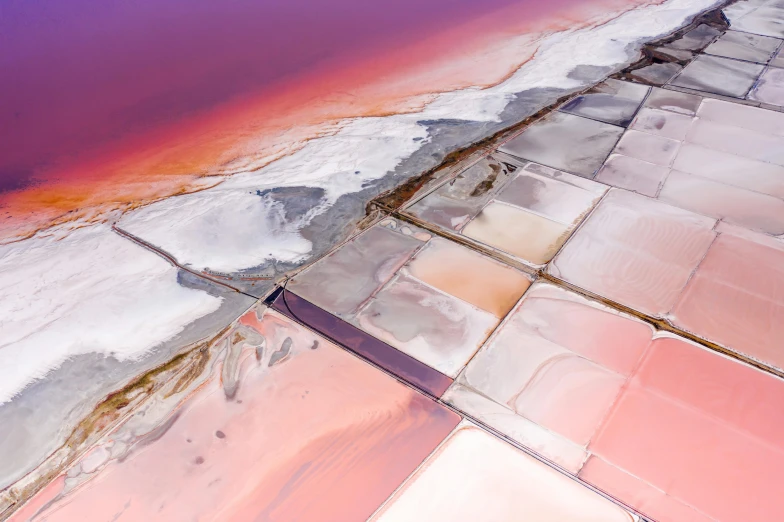 an aerial view of a large body of water, inspired by Scarlett Hooft Graafland, unsplash contest winner, color field, white and pink cloth, mining, orange and purple electricity, illustration”