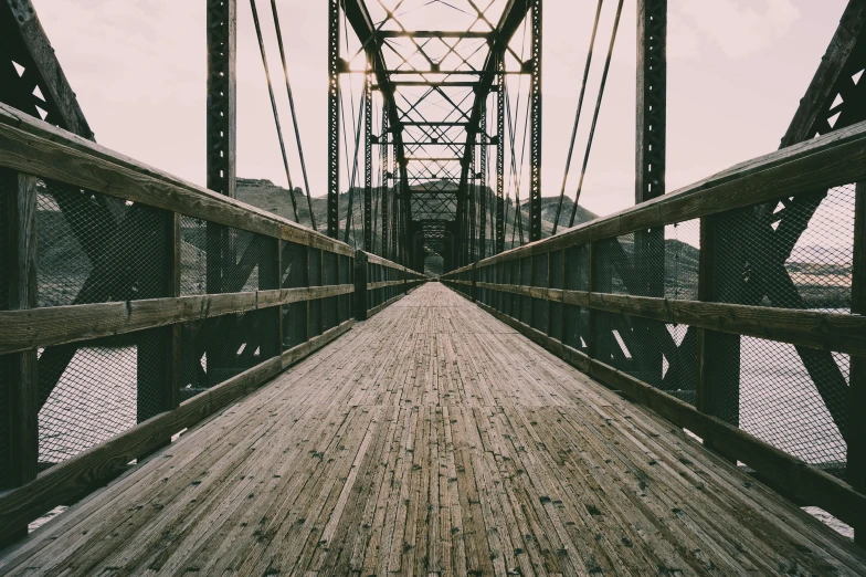 a wooden bridge over a body of water, unsplash, postminimalism, 2 5 6 x 2 5 6 pixels, industrial aesthetic, multiple stories, ((rust))