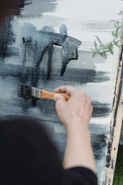 a woman is painting a picture of a bear, inspired by Hans Hartung, trending on pexels, arbeitsrat für kunst, gray canvas, worn paint, architectural painting, painting on silk