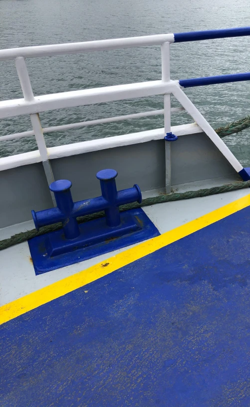 a red fire hydrant sitting on the side of a boat, ultramarine, interior of staten island ferry, low quality photo, (bolts)