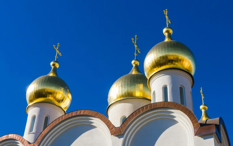 a white building with gold domes against a blue sky, by Julia Pishtar, square, russian academic, christianism, multicoloured