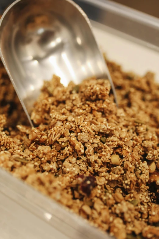 a close up of a container of food with a spoon, botanicals, luscious with sesame seeds, cereal, smooth blending