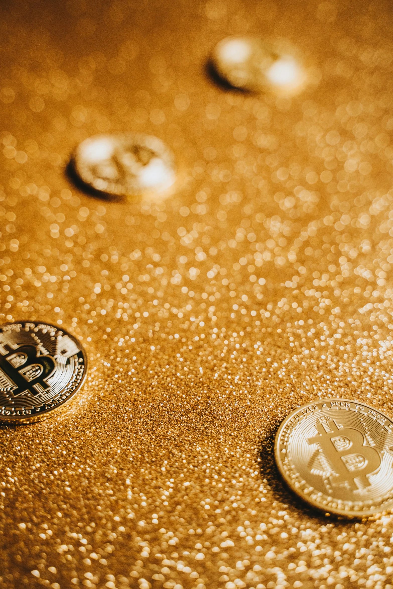 a bunch of coins sitting on top of a table, gold dust, crypto, thumbnail, getty images