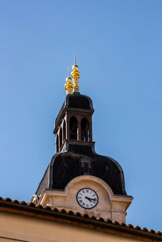 a clock that is on the side of a building, romanesque, golden towers, lots de details, clear blue skies, domes