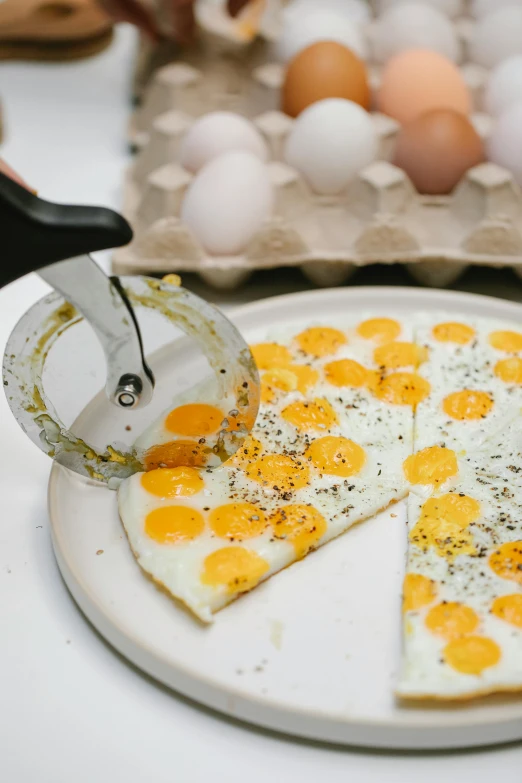 a pizza sitting on top of a white plate, translucent eggs, scrape them, ultra precise, spatter