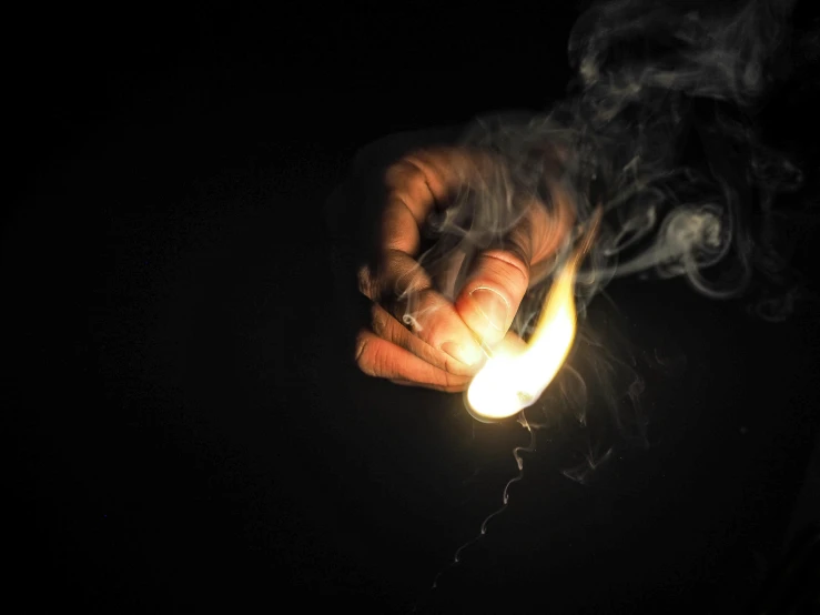 a person holding a lighter in their hand, pexels, auto-destructive art, made of glowing wax, instagram photo, ignant, fireball hand