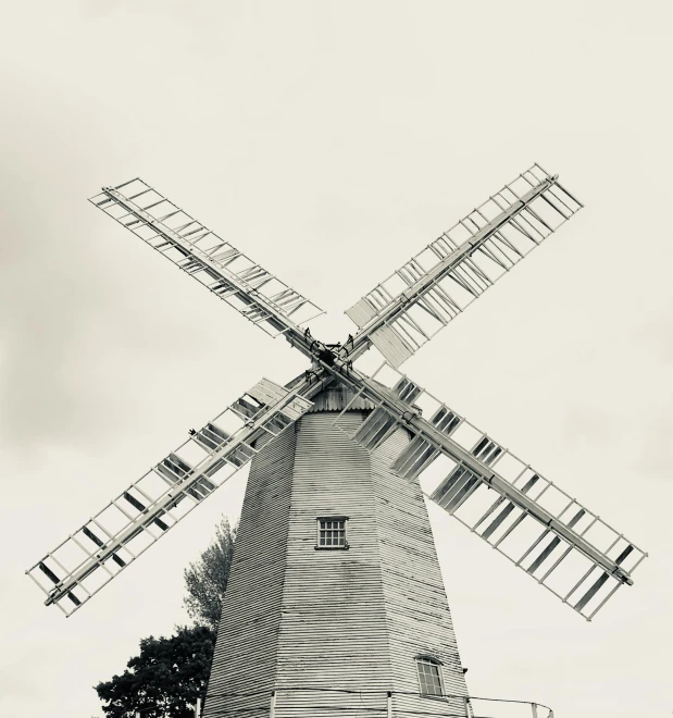 a black and white photo of a windmill, a black and white photo, pexels contest winner, arts and crafts movement, in muted colours, madgwick, large format, the