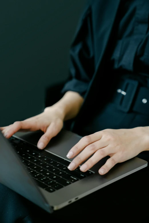 a close up of a person using a laptop, wearing black clothes, thumbnail, officer, androgynous person