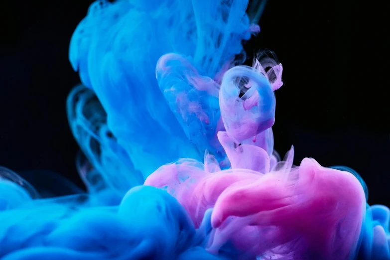 a close up of a blue and pink substance, inspired by Kim Keever, pexels contest winner, high contrast colours, color ink, looking towards camera, instagram post