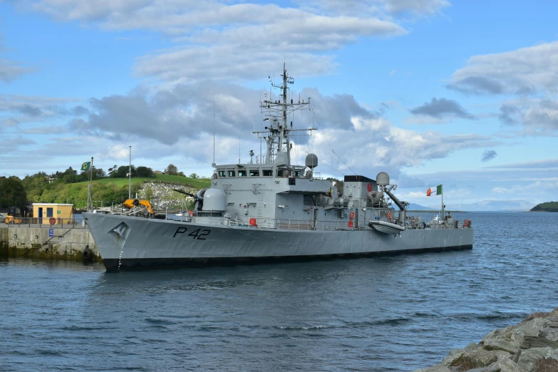 a large boat sitting on top of a body of water, a portrait, navy, mayo, high quality photos, youtube thumbnail