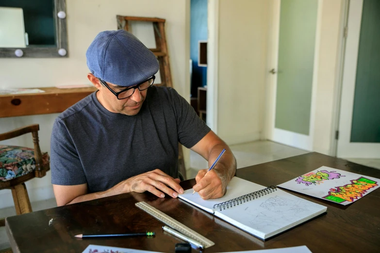 a man sitting at a table writing on a piece of paper, a drawing, by Meredith Dillman, blippi, design art, paul barson, drawing pictures on a notebook