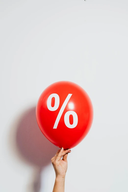 a person holding a red balloon with a percentage sign on it, trending on unsplash, new objectivity, 🎀 🍓 🧚, panel, brown, off putting