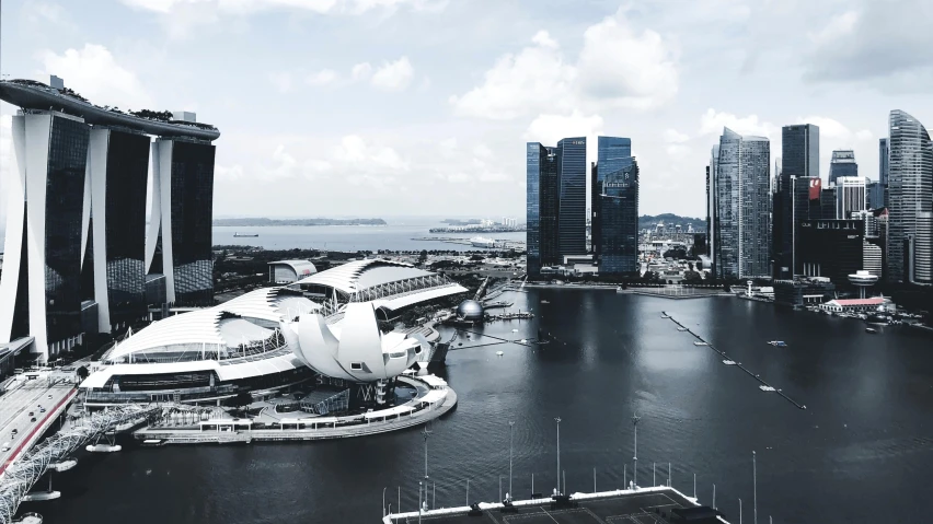 a black and white photo of a city, inspired by Zha Shibiao, pexels contest winner, hyperrealism, singapore esplanade, shaped like a yacht, white buildings with red roofs, sustainable architecture