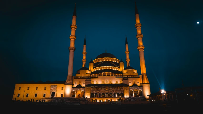 a mosque lit up at night with the moon in the sky, an album cover, pexels contest winner, hurufiyya, ☁🌪🌙👩🏾, classical architecture, neon blue and yellow lights, turkey