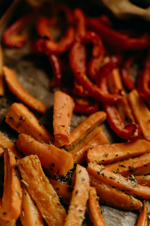 a close up of a tray of food on a table, a digital rendering, pexels, carrots, fry, woodfired, thumbnail