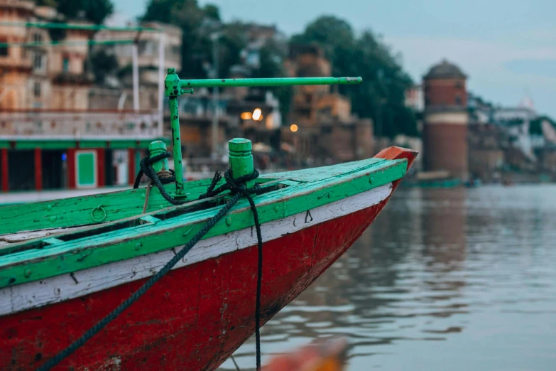 a red and green boat sitting on top of a body of water, pexels contest winner, uttarakhand, port scene background, 🦑 design, print ready