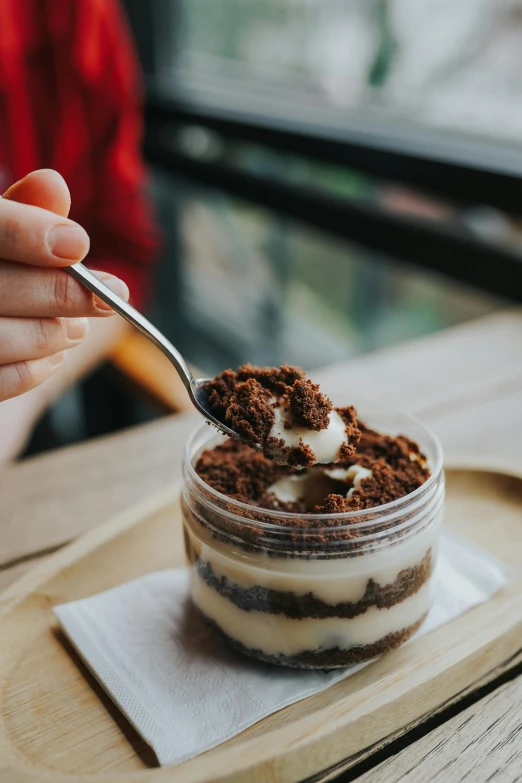 a close up of a person eating a dessert, trending on pexels, dreamscape in a jar, brown haired, melbourne, celebration of coffee products