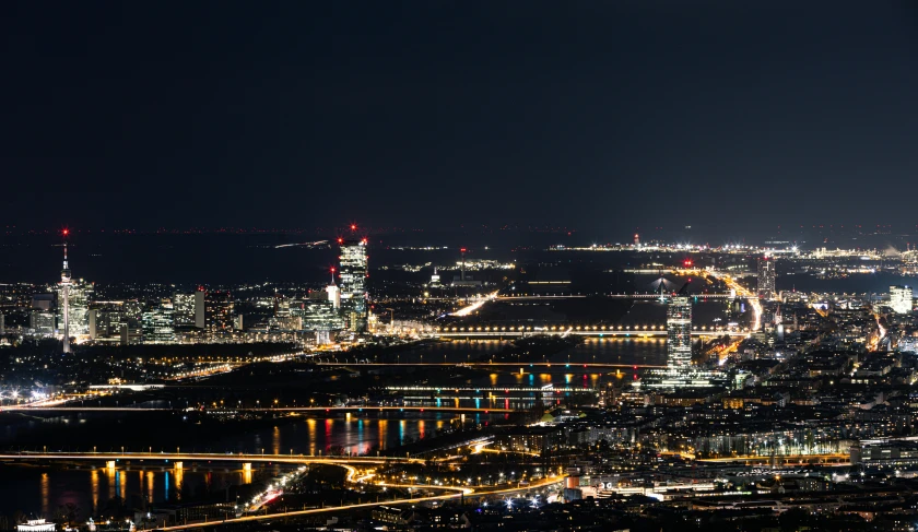 an aerial view of a city at night, by Jakob Emanuel Handmann, pexels contest winner, new jersey, viewed from a distance, landscape vista, multiple lights