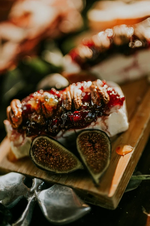 a wooden cutting board topped with figs and cheese, by Winona Nelson, pexels contest winner, dragon fruits, forest details, smoked layered, sparkling