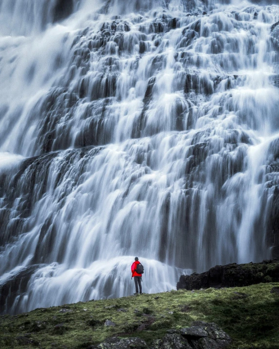 a person standing in front of a waterfall, stacked image, reykjavik, trending photo, thumbnail