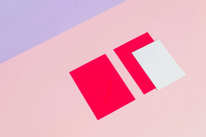 a piece of paper sitting on top of a pink and blue surface, pink and red color style, cards, dezeen showroom, red and white neon