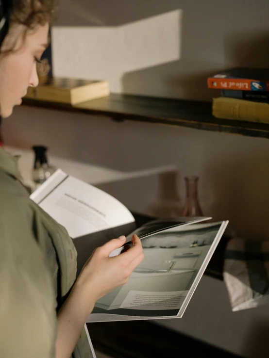 a woman reading a book while wearing headphones, visual art, inspect in inventory image, light academia aesthetic, gif, close up photograph