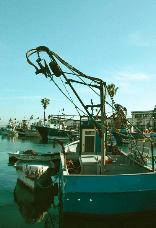 a boat that is sitting in the water, fishing town, oceanside, hooked nose and square jaw, julia sarda