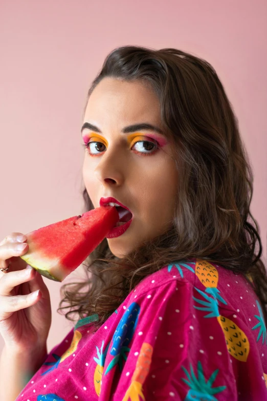 a woman is eating a slice of watermelon, an album cover, by Julia Pishtar, trending on pexels, queer woman, sexy face, yael shelbia, alison brie