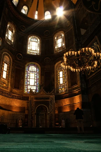 a room filled with lots of windows and a chandelier, inspired by Abraham van den Tempel, pexels contest winner, turkey, tomb, panorama shot, bl