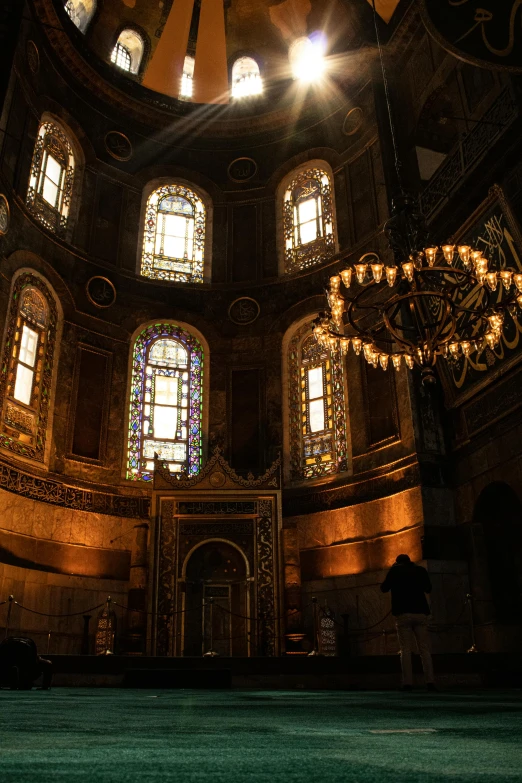 a room filled with lots of windows and a chandelier, inspired by Abraham van den Tempel, pexels contest winner, turkey, tomb, panorama shot, bl