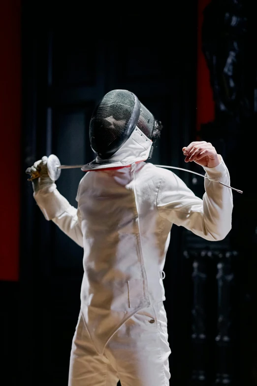 a man in a fencing suit holding a sword, happening, photo taken in 2 0 2 0, getty images, badminton, white helmet