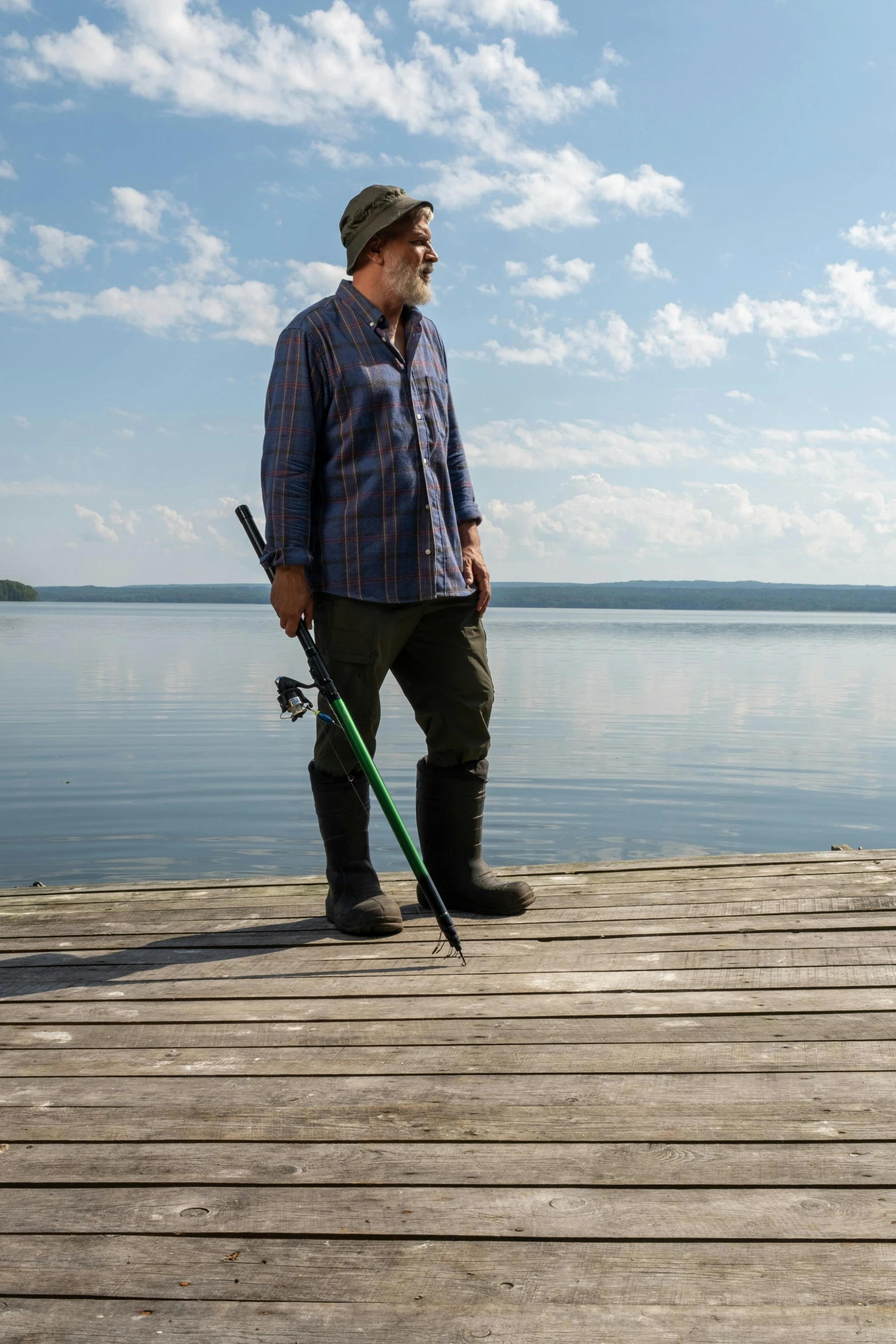 a man standing on a dock next to a lake, a portrait, by Eero Järnefelt, unsplash, plein air, with leviathan axe, production still, cel shad, fishing pole