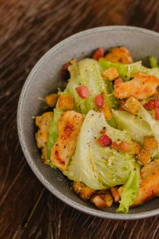 a close up of a bowl of food on a table, by Jason Felix, lettuce, thumbnail, chicken, saturno buttò