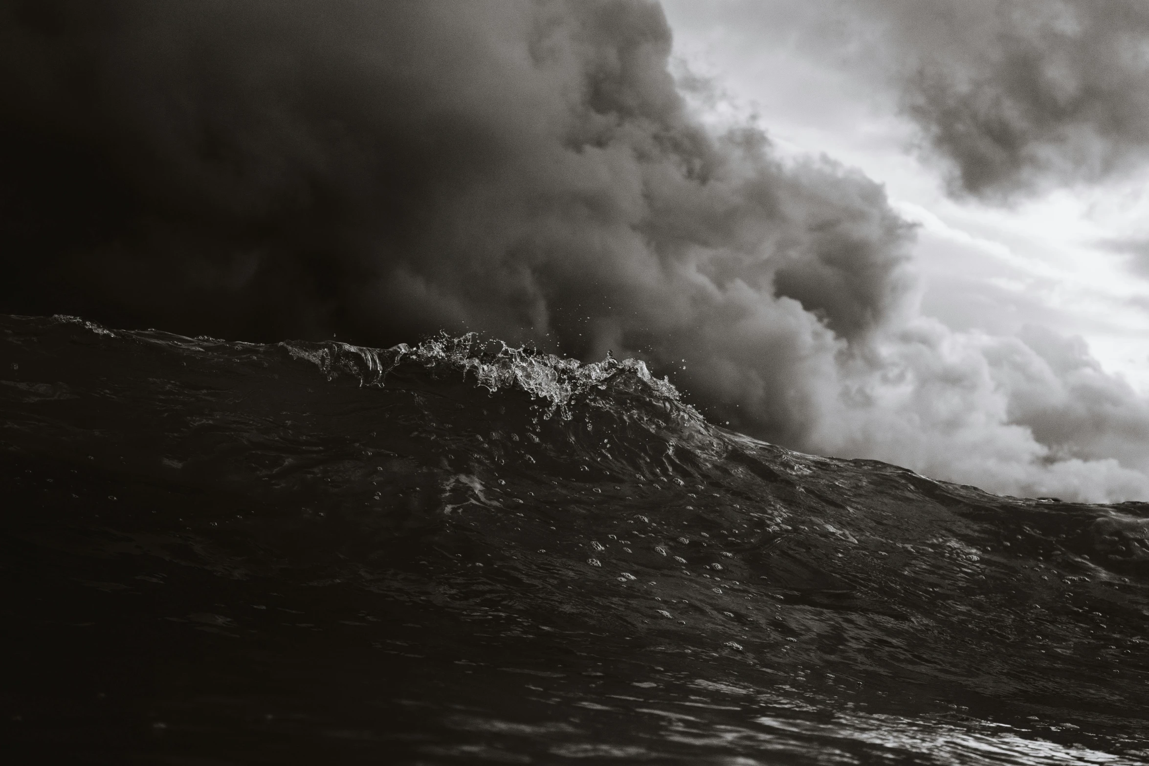 a man riding a wave on top of a surfboard, a black and white photo, pexels contest winner, surrealism, chaotic storm of liquid smoke, ( apocalyptic ) 8 k, deep sadness, photo of a camp fire underwater