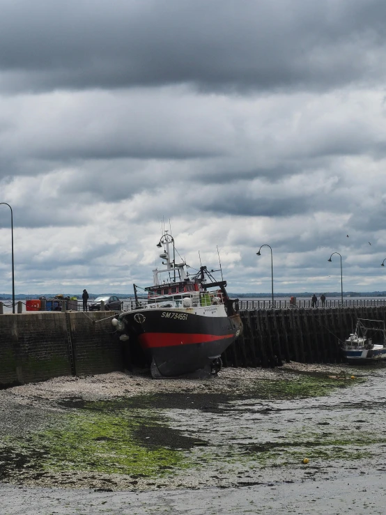 a couple of boats that are sitting in the water, maryport, 2022 photograph, maintenance photo