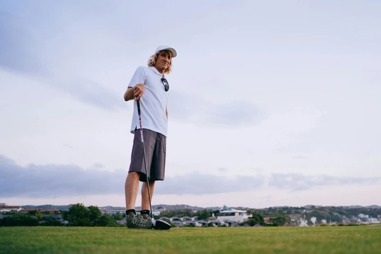 a man standing on top of a lush green field, wrx golf, instagram picture, wearing a baggy, sam hyde