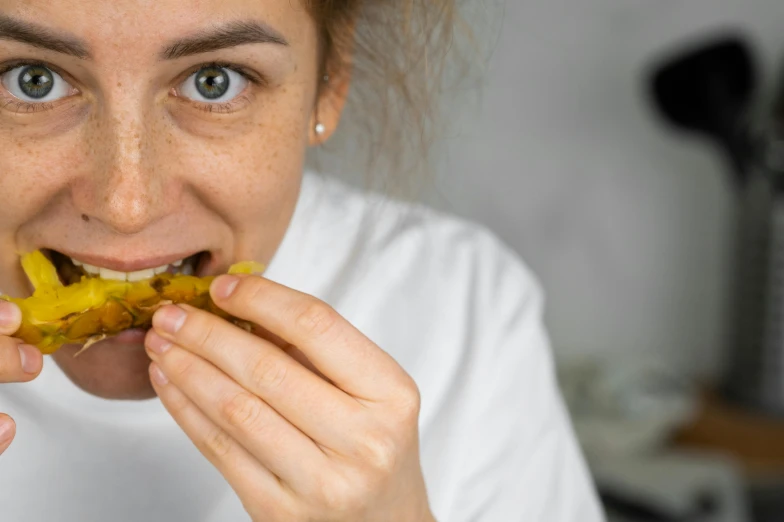 a close up of a person eating a piece of food, sanja stikovic, profile image, pastry lizard, underbite