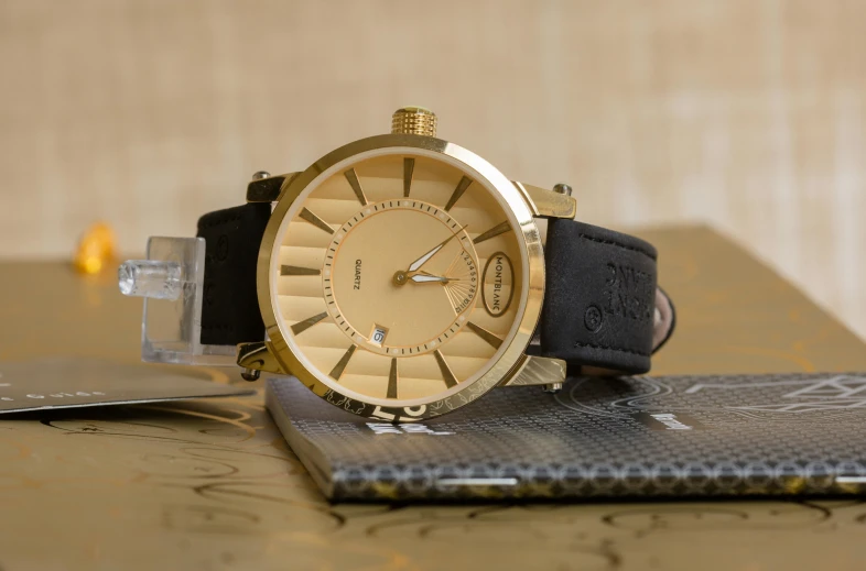 a close up of a watch on a table, inspired by Eliseu Visconti, pexels contest winner, relaxed. gold background, gold black, hansa yellow, thumbnail