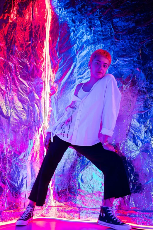 a man standing on a trampol in front of a waterfall, an album cover, inspired by David LaChapelle, unsplash, short platinum hair tomboy, hero pose colorful city lighting, sophia lillis, glowing with colored light