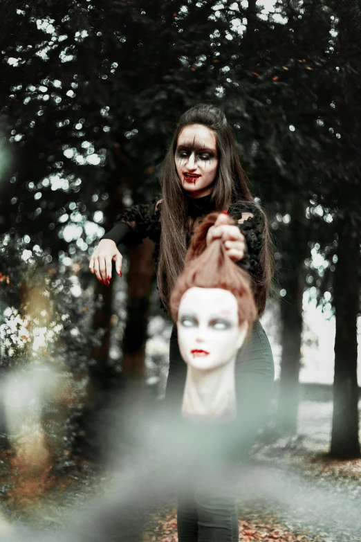 a woman standing next to a mannequin head, pexels contest winner, gothic art, witch in the woods, threatening pose, avatar image, headshot profile picture