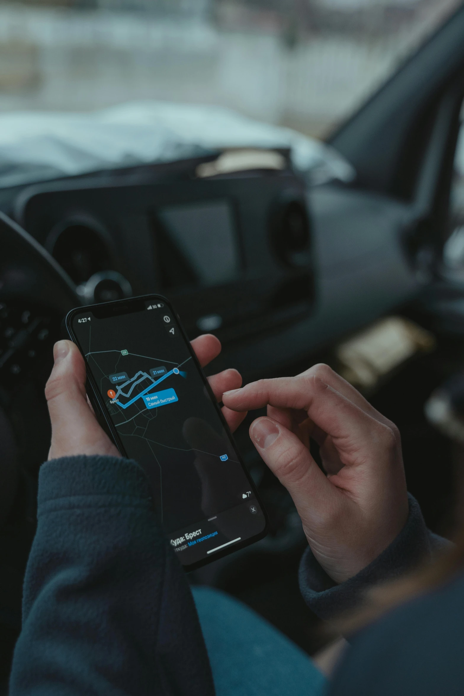 a person holding a cell phone in a car, mapbox, dark mode, avatar image, square