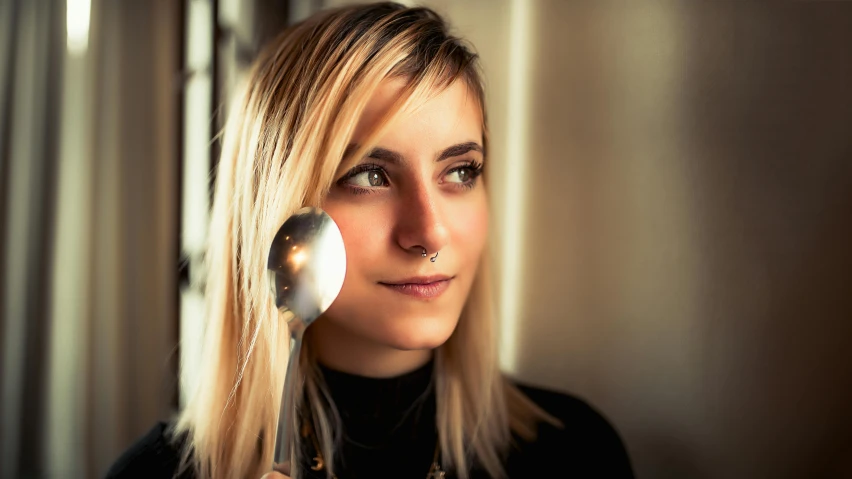 a close up of a person with a hair brush, a portrait, by Julia Pishtar, pexels contest winner, ( waitress ) girl, spoon, evanna lynch, side light